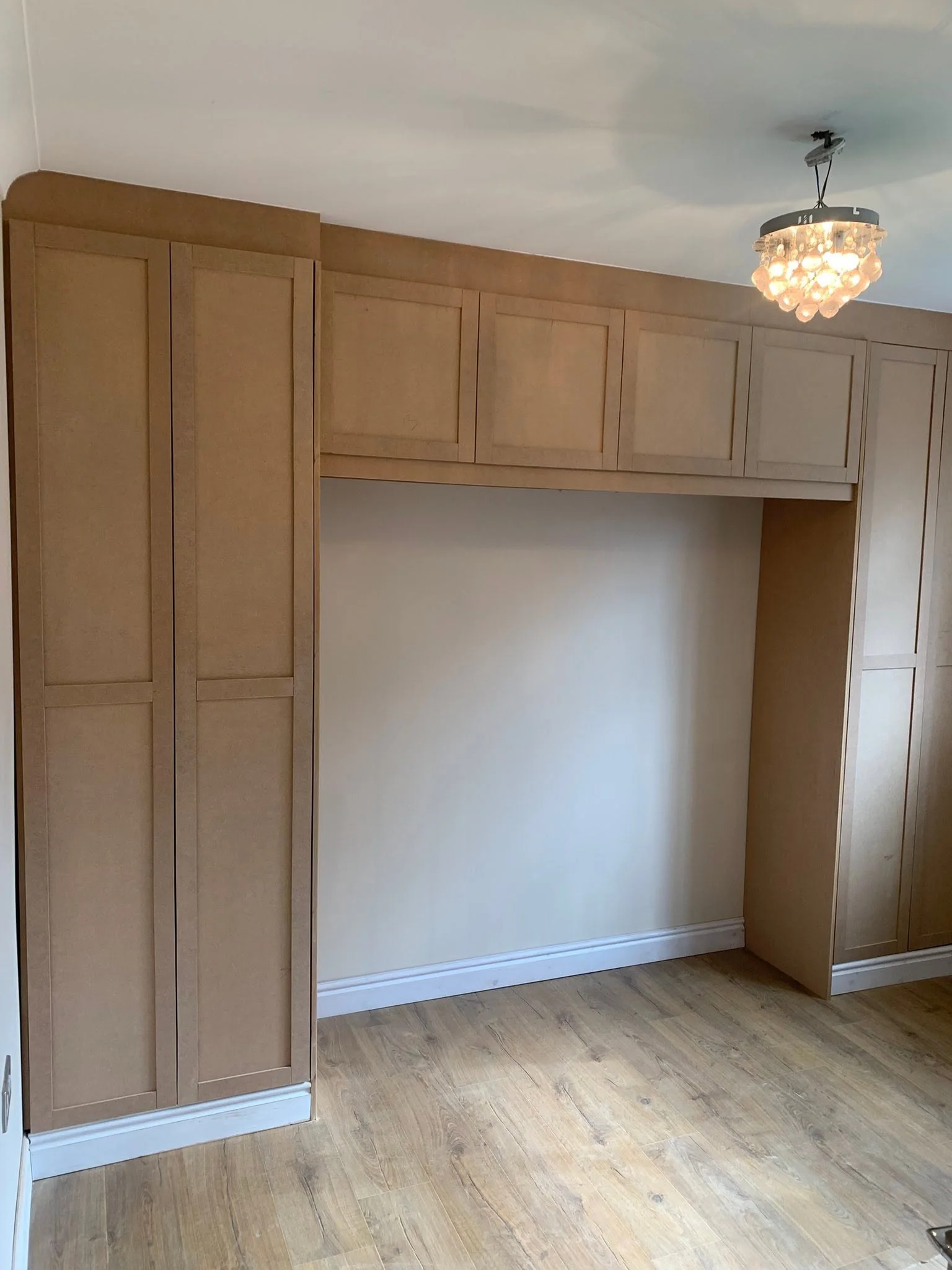 Open fitted cabinetry showing practical internal storage