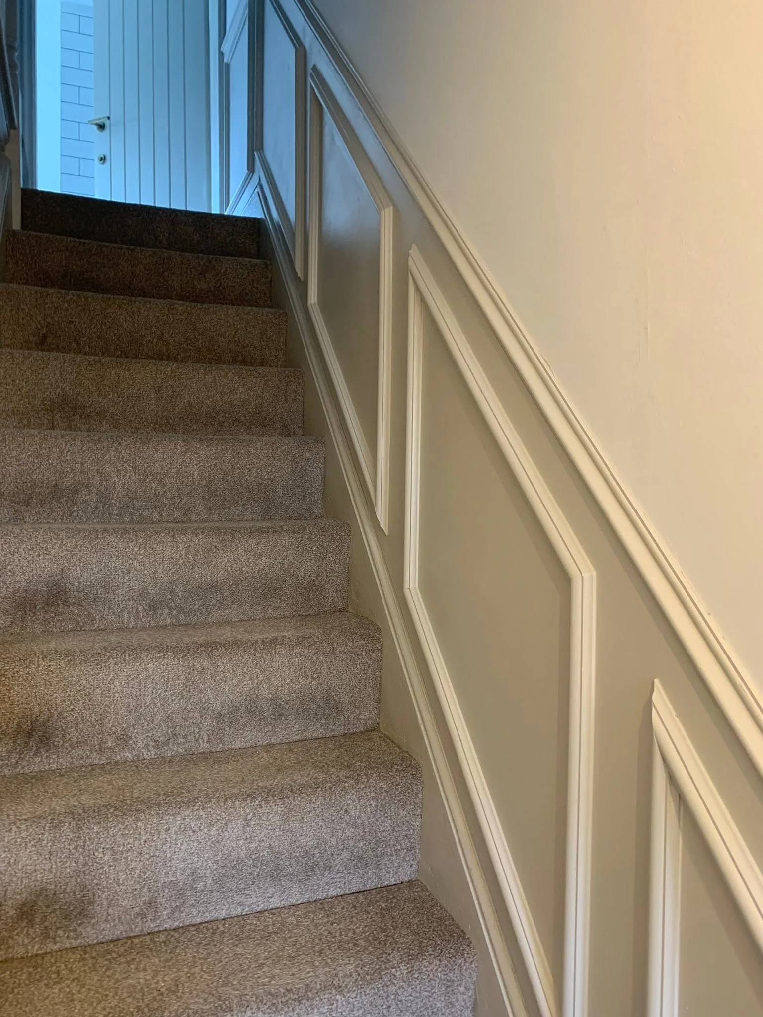Detailed junction in painted stair panelling