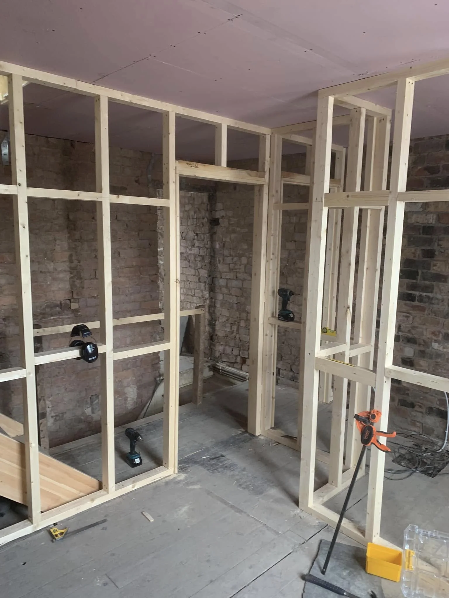 Interior studwork being carefully assembled on site