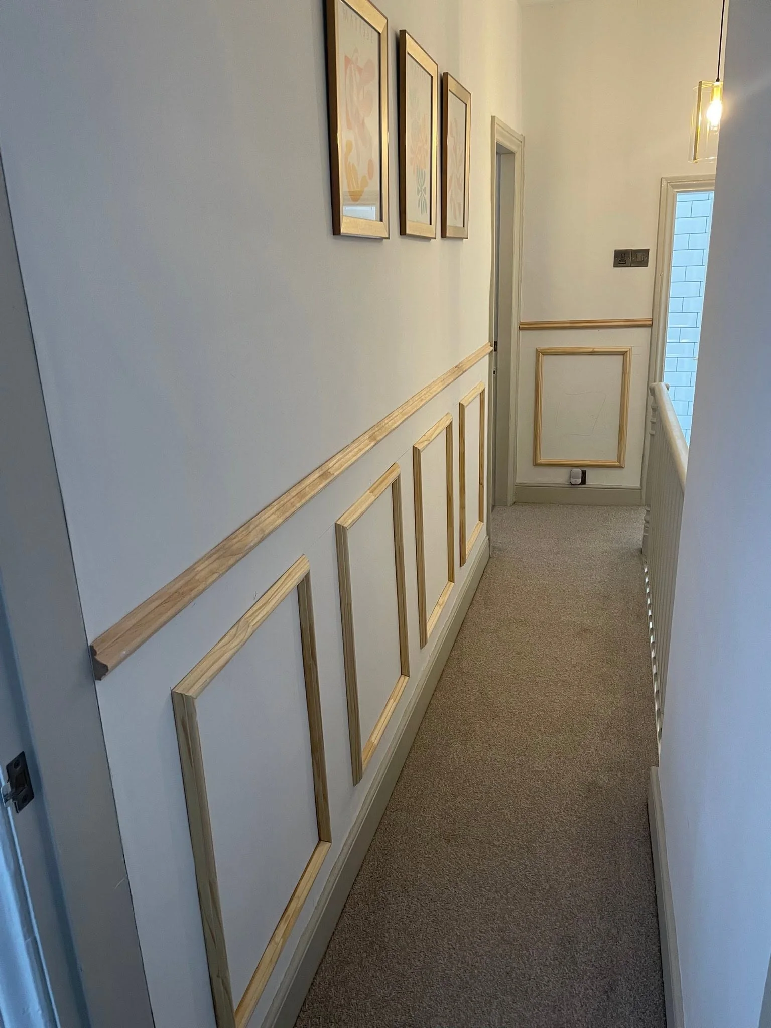 Close view of measured painted wall panelling